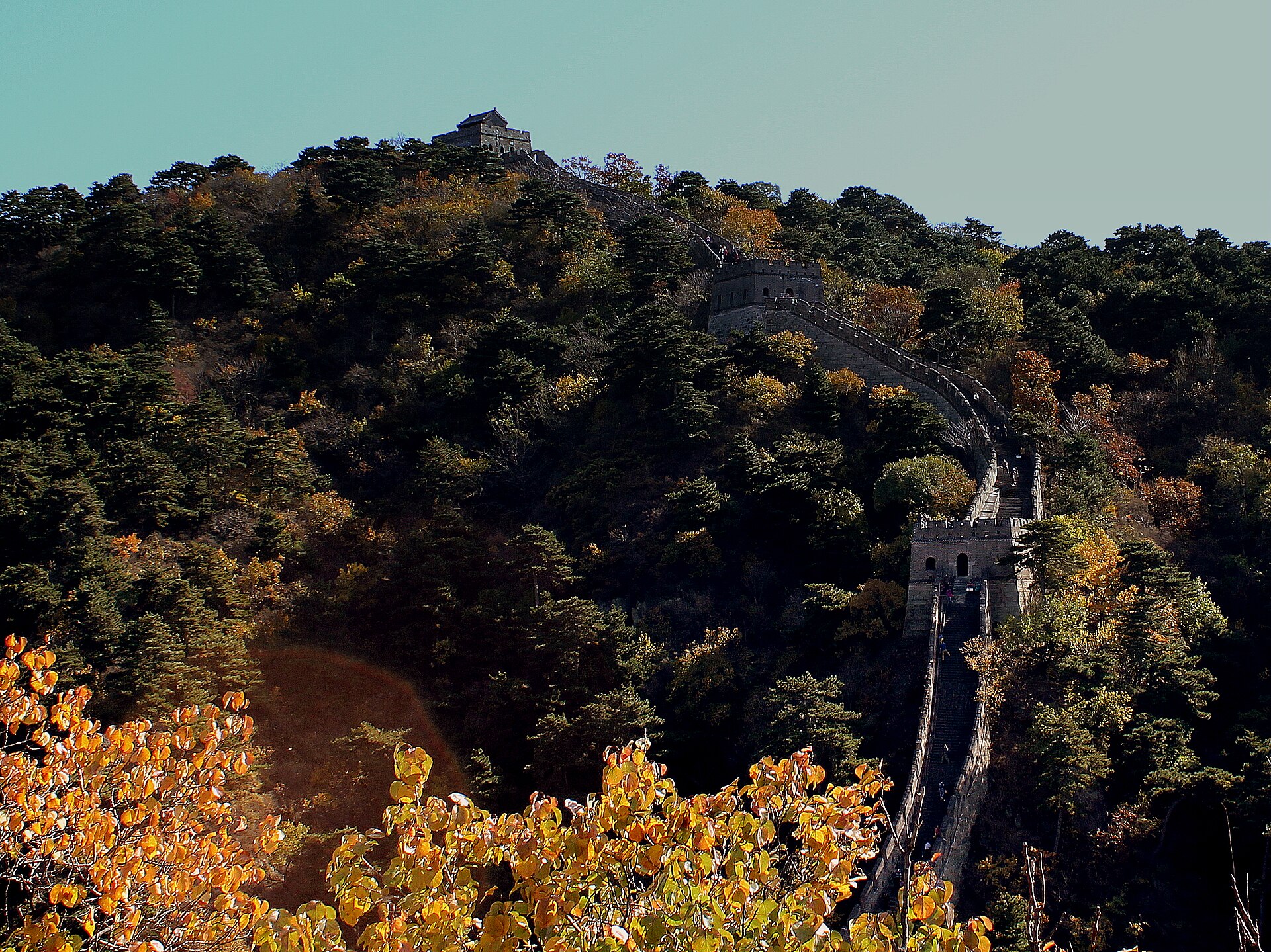 Mutianyu Great Wall crossing forested Beijing hills with late-October autumn foliage.