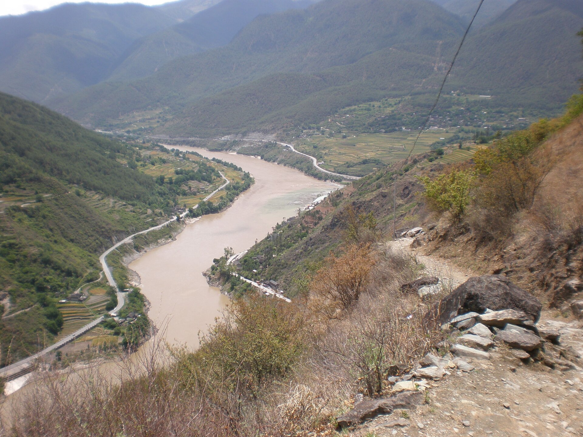 A narrow hillside path overlooks the river and valley roads in a 2008 Tiger Leaping Gorge photograph.