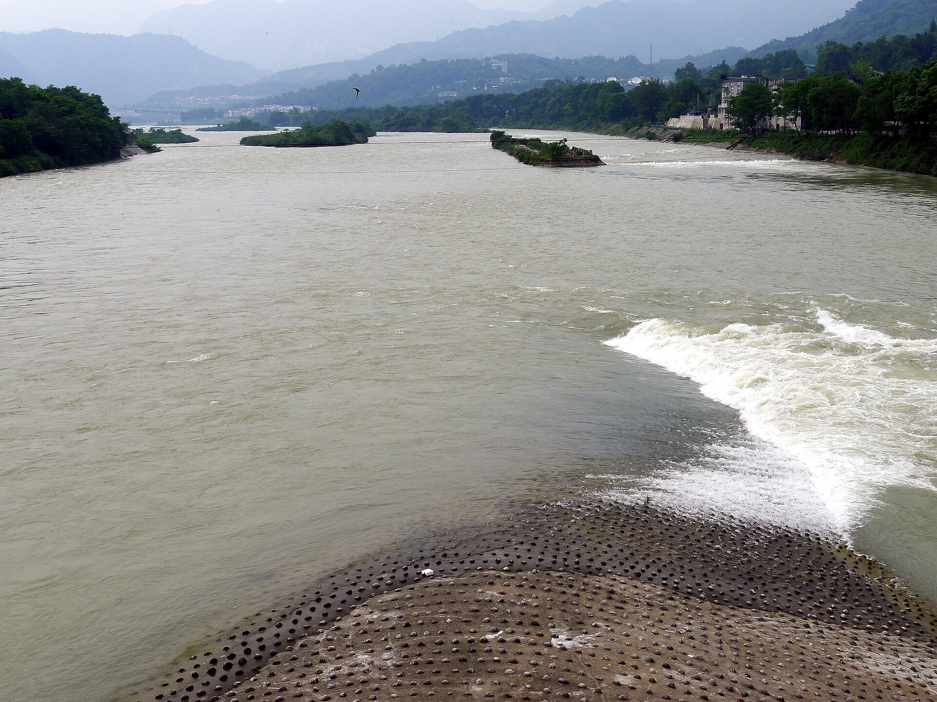 The pointed Fish Mouth revetment dividing river channels at the Dujiangyan Irrigation System.