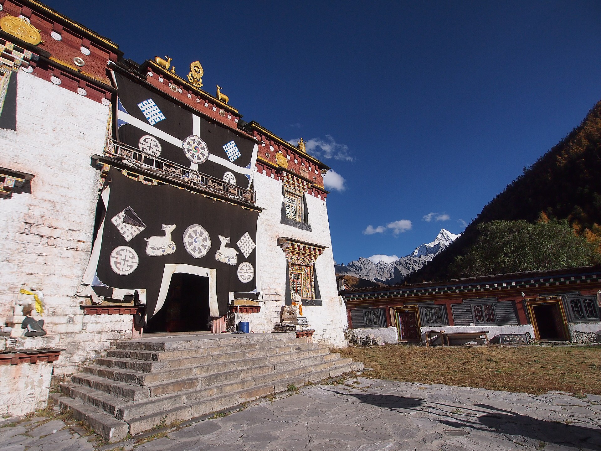 The exterior of Chonggu Temple stands below a mountain in Yading in October 2012.