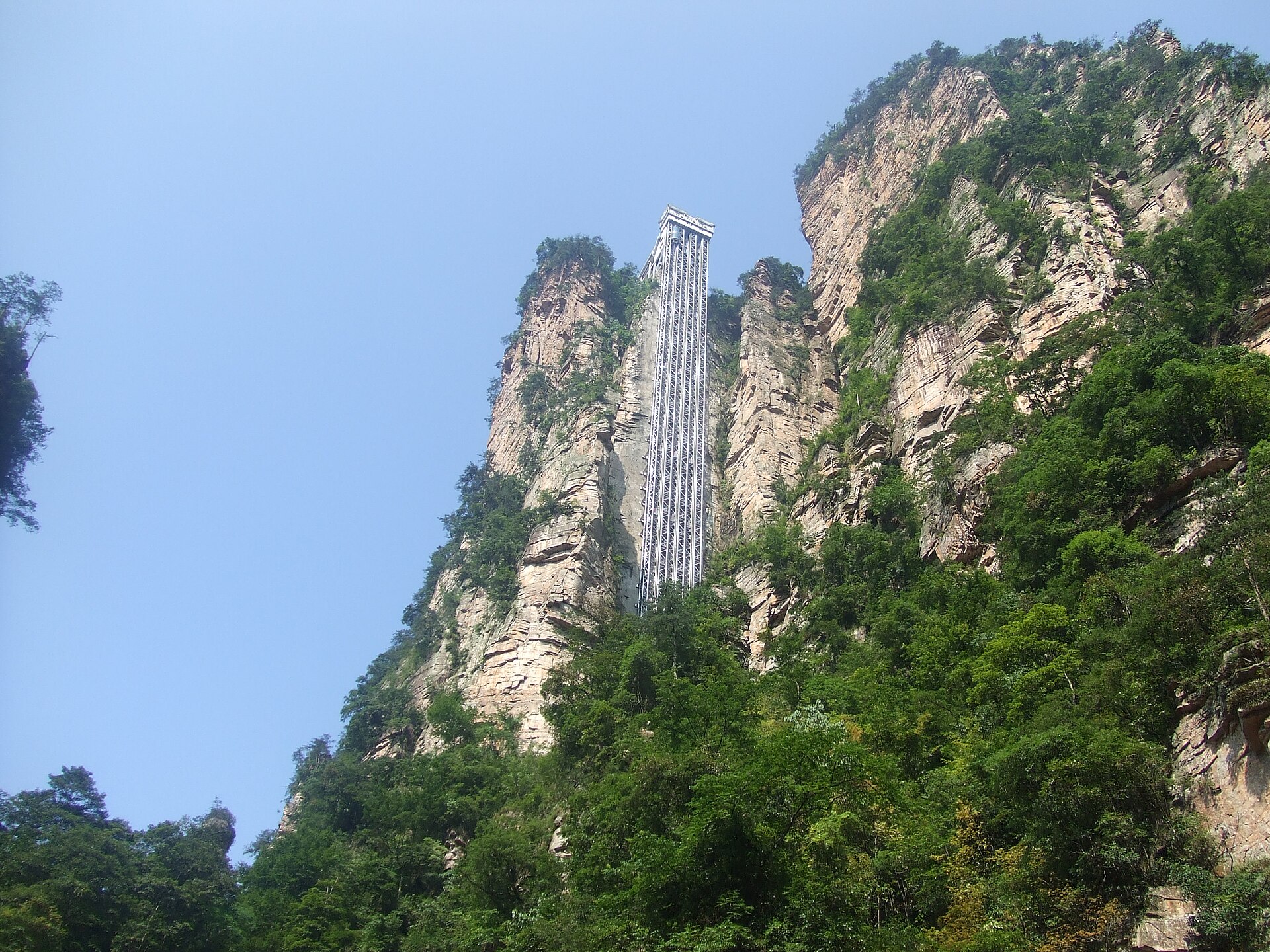 The Bailong Elevator's vertical lift structure rising against a cliff in Zhangjiajie in 2009.