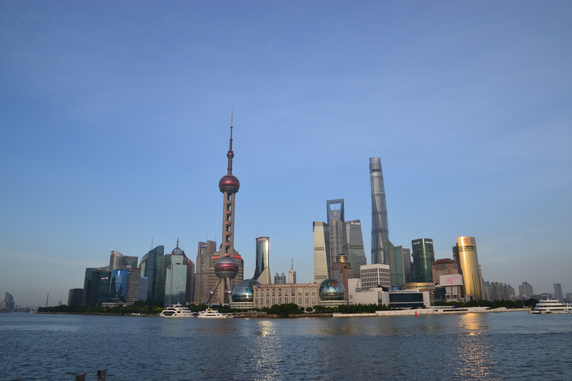 Lujiazui skyline with Shanghai Tower across the Huangpu River at dusk